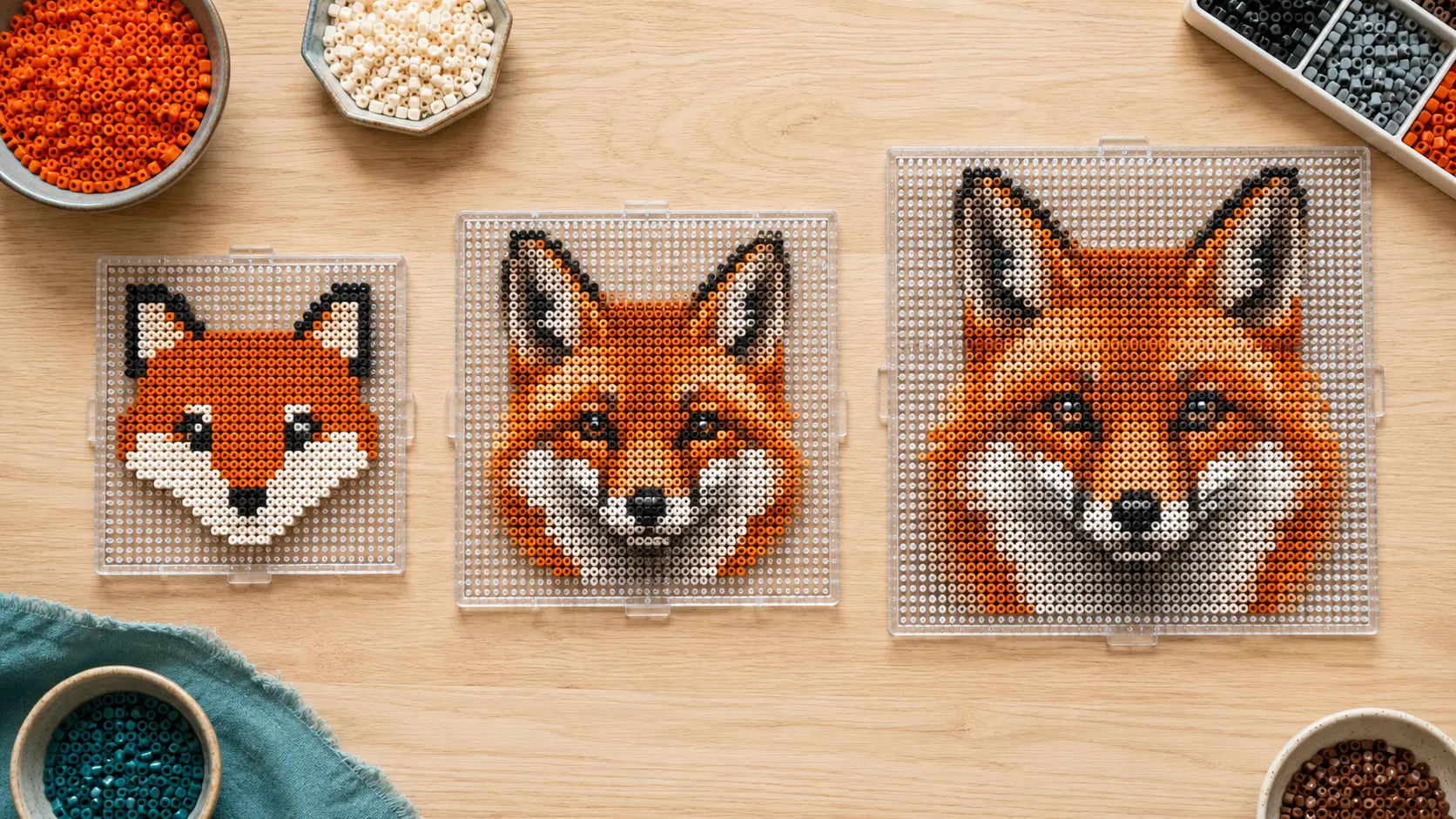 Three fox Perler bead patterns showing increasing detail at small, medium, and large grid sizes